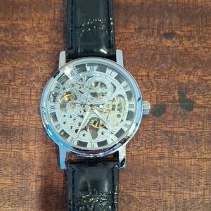 Intricate Silver Skeleton Watch with Black Strap